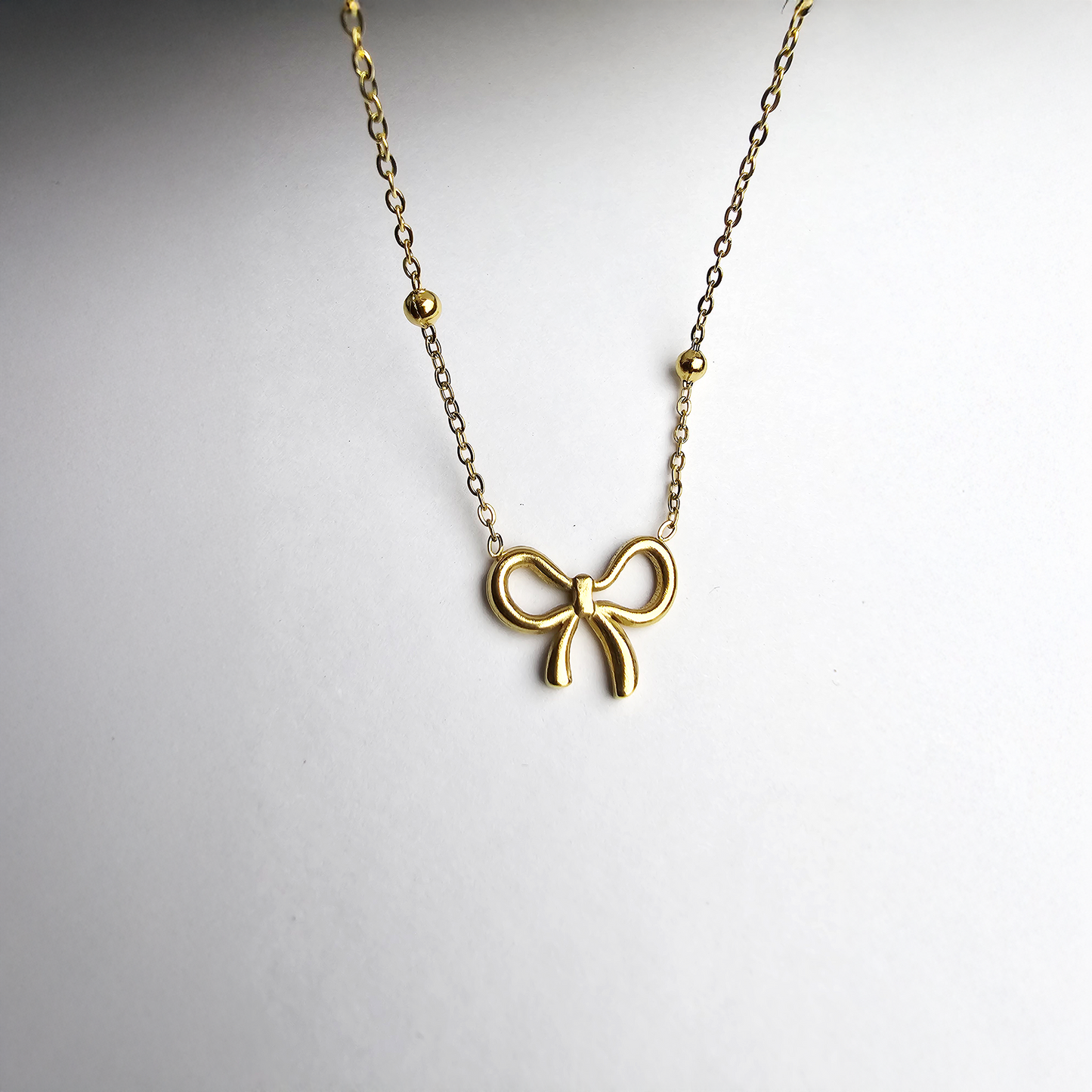 The Elegant Infinity Bow Pendant - Aagrah Jewels™